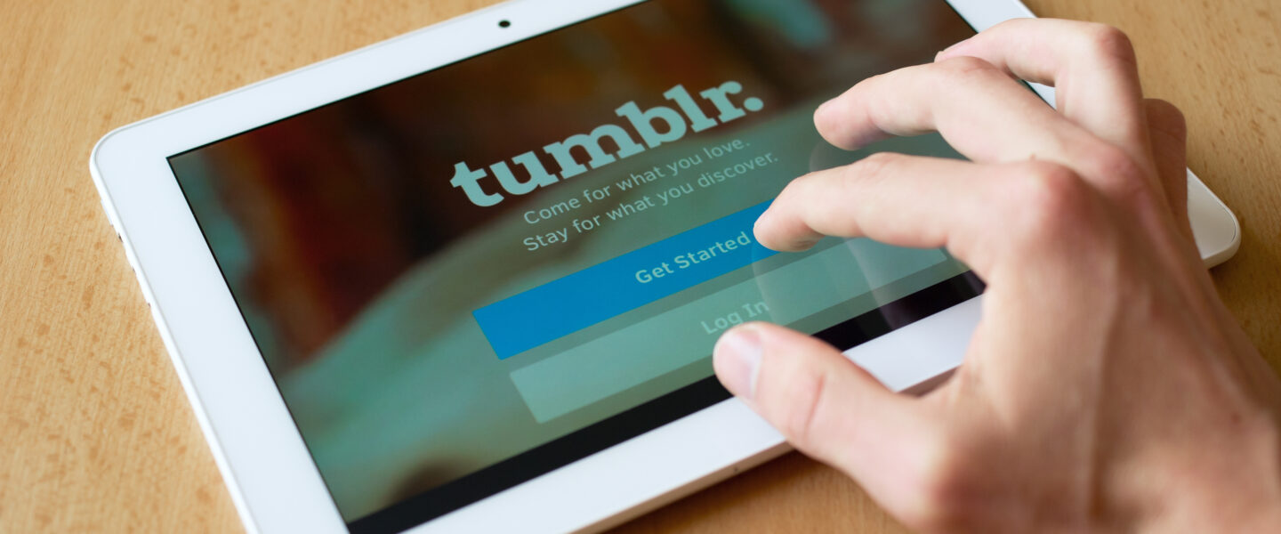 person logging in tumblr on a tablet